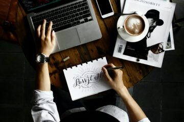 A person working an expat job on a computer