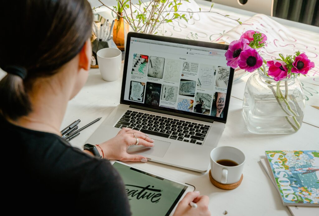 A person working a creative job on a laptop