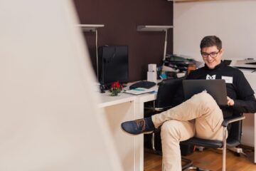 MSP founder on his laptop, looking to hire a remote MSP dispatcher for hire organization.